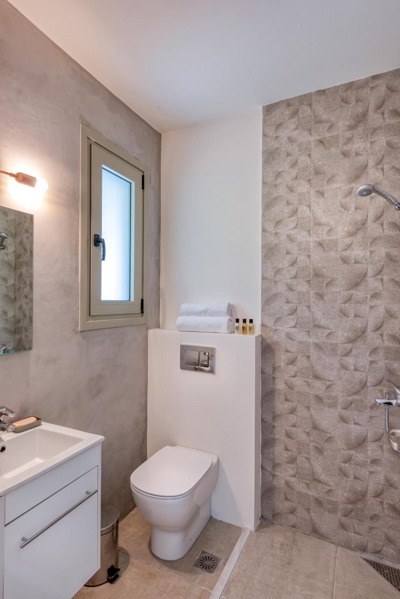 Saronis Suites Saronida Quarto foto